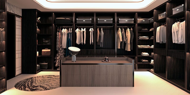 Mirrors, Glass Shelves, and Lighting Can Make All the Difference for a Walk-In Closet
